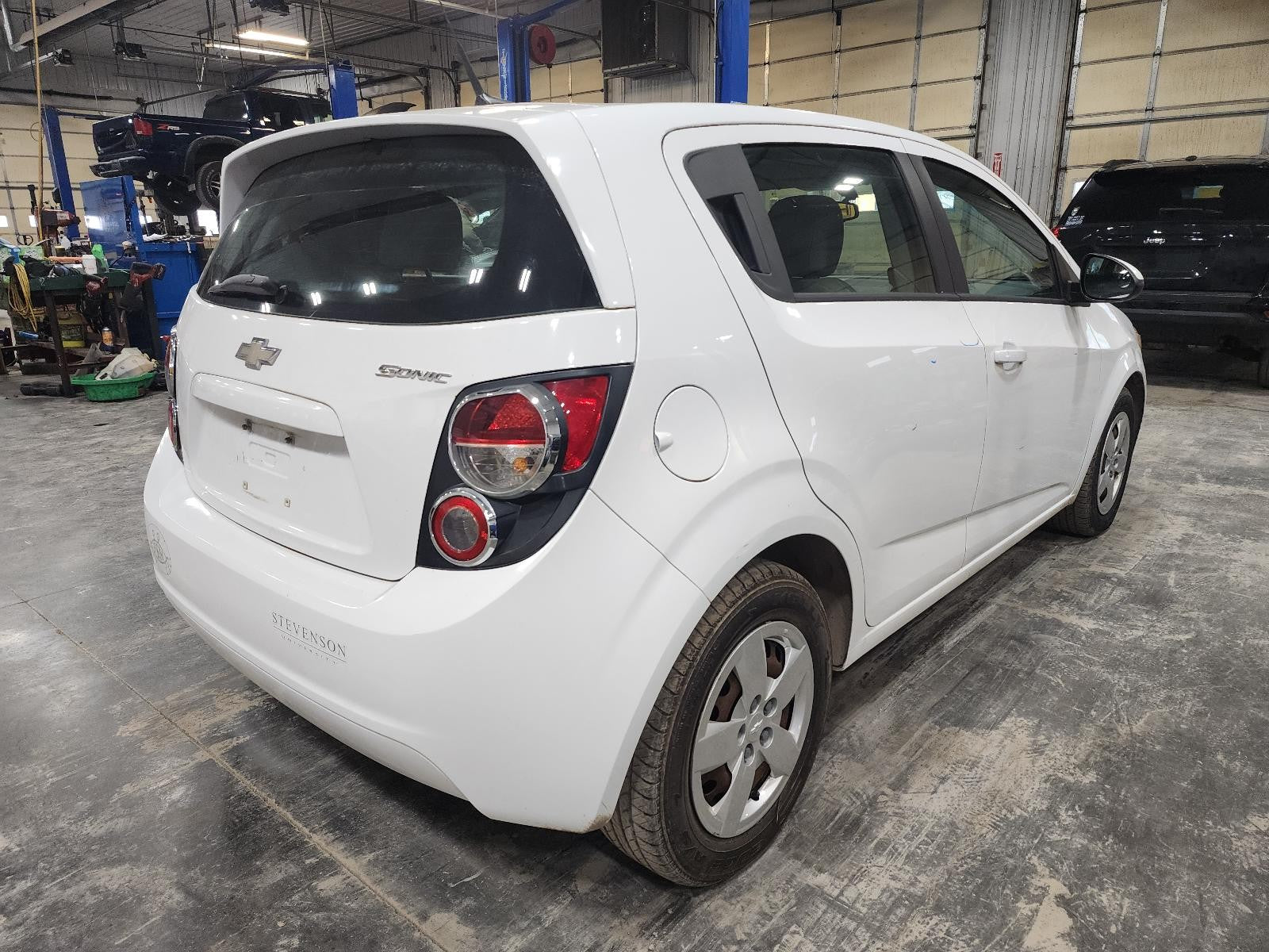 Used Right Headlight Assembly fits: 2014 Chevrolet Sonic w/high gloss finish opt