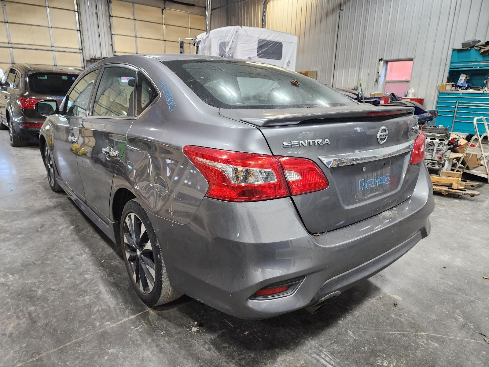 Used Rear Bumper Assembly Rear fits: 2017 Nissan Sentra S Rear Grade A